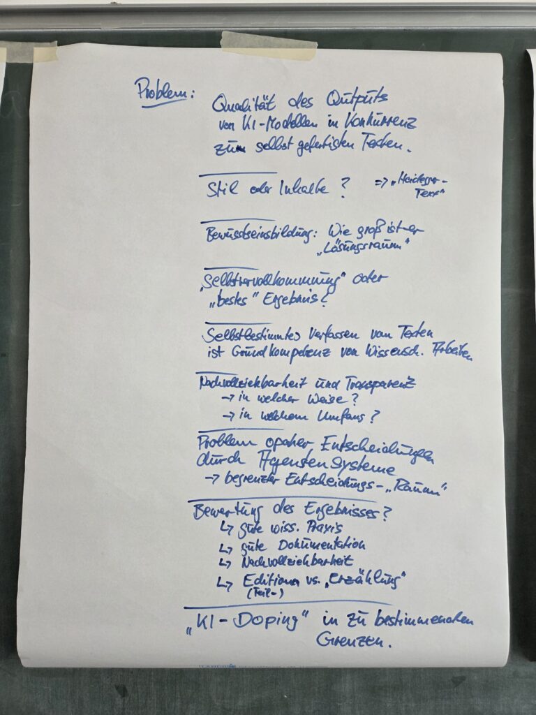 Foto eines der Flipcharts vom Tisch "Maximen/Gesetze zur KI-Anwendung" während des Open Space (DH-Tag 2026)